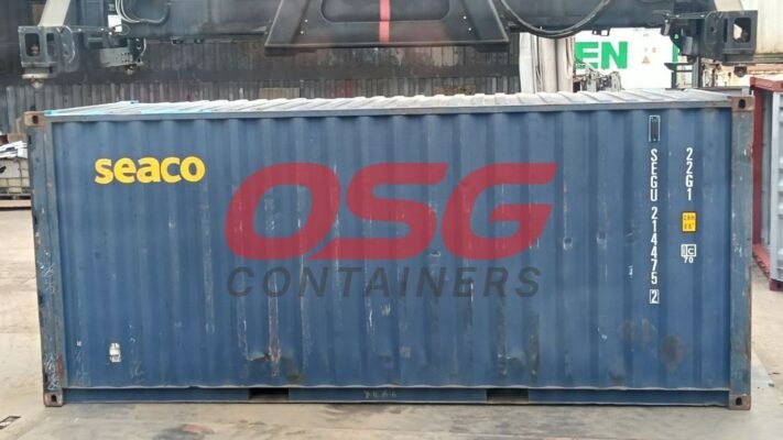 A blue shipping container with OSG Containers and Seaco logos.